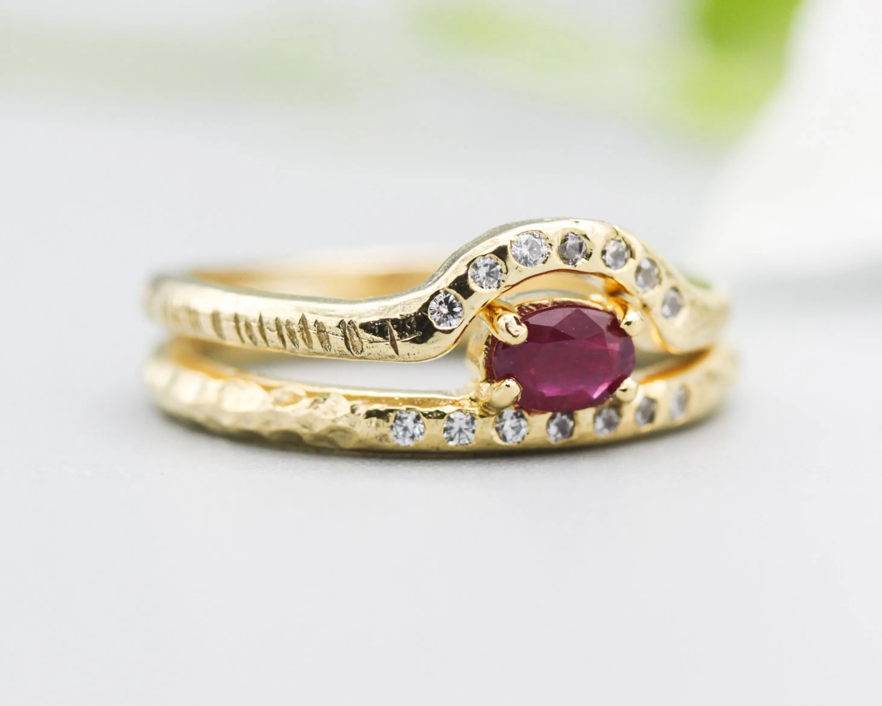 Set of 2 Oval faceted Ruby ring with tiny diamonds on 14k gold band set with 14k gold band ring with tiny 7 diamond on the center