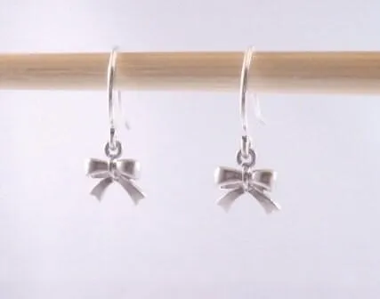 Tiny Silver Bow Earrings, small bow earring, tiny ribbon earring, tied ribbon earring, bow dangle earring, little silver bow earring, mini